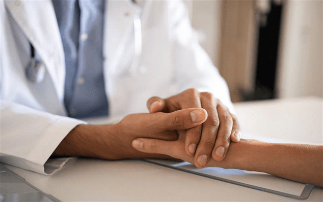 Friendly Doctor His Patient Holding Hands